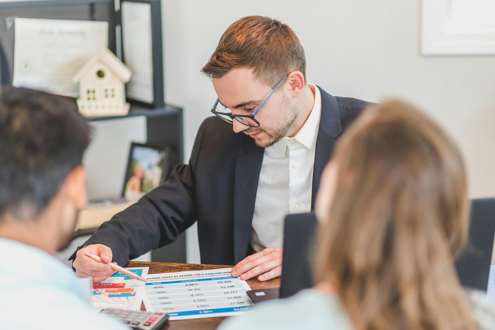 Financial advisor discussing loan options with clients